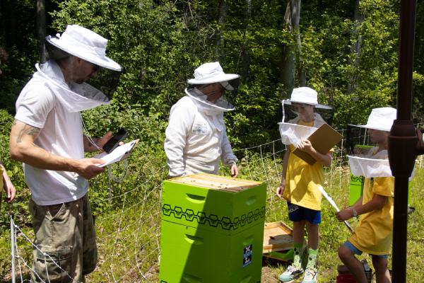 Beekeepers talking to attendees of Excel Dryers Honey Event