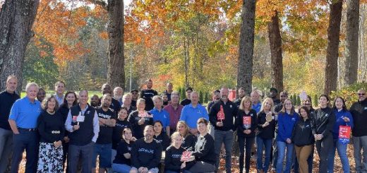 group pic with great place to work sign