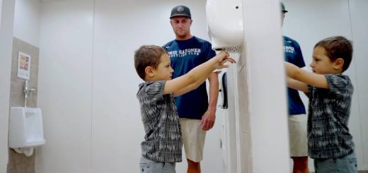 Boys using hand dryer